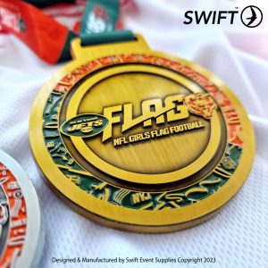 Personalised sports medals close up high quality image. Enamelled bespoke medals.
