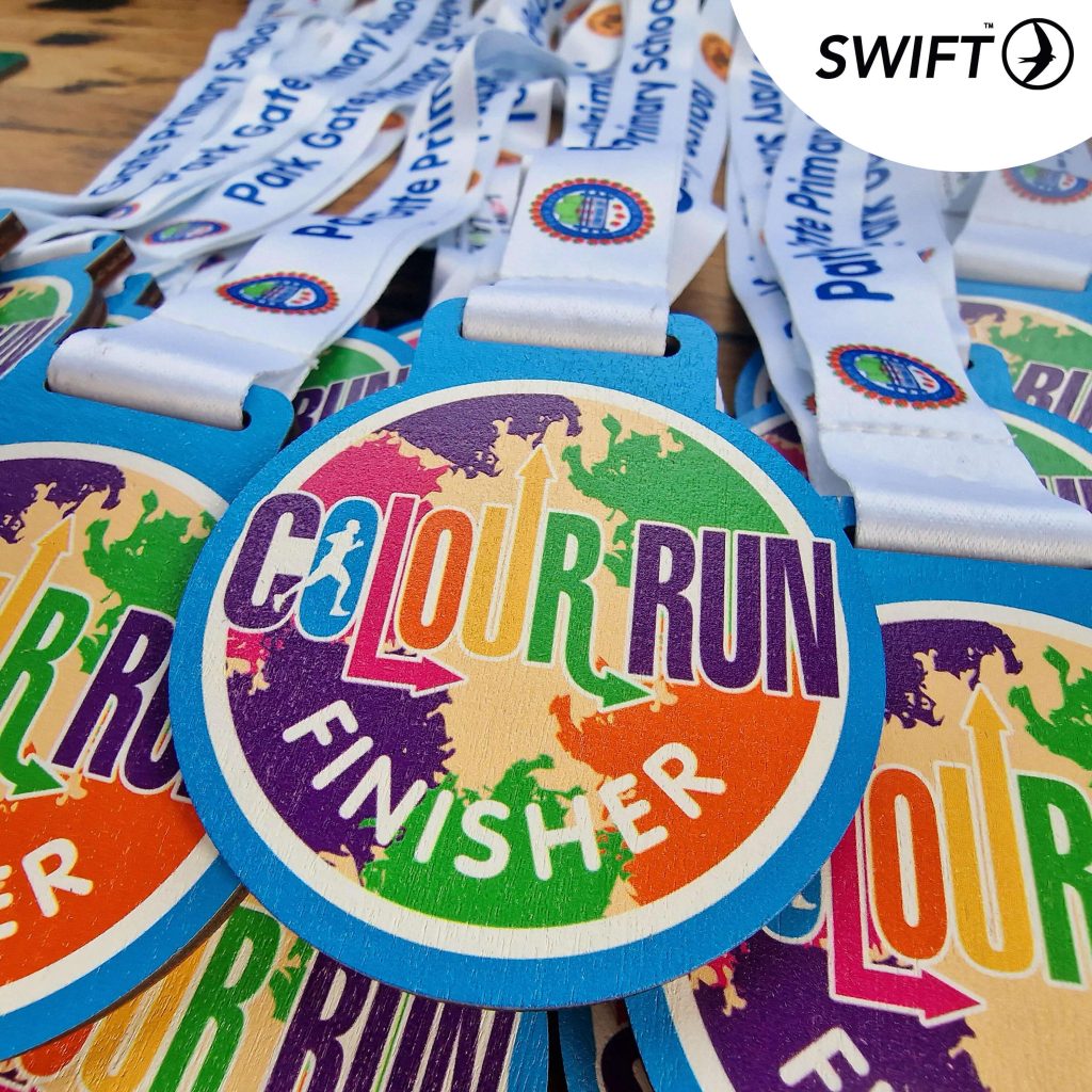 Wooden colour run medals for colour runs and school colour runs in the UK. UV printed wooden sports medals for colour runs. Eco-friendly colour run medals and printed ribbons.